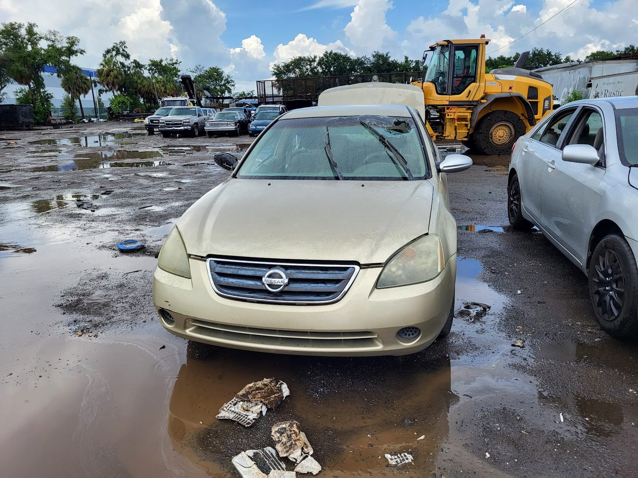 A non-running sedan waiting in our Tampa Bay salvage yard