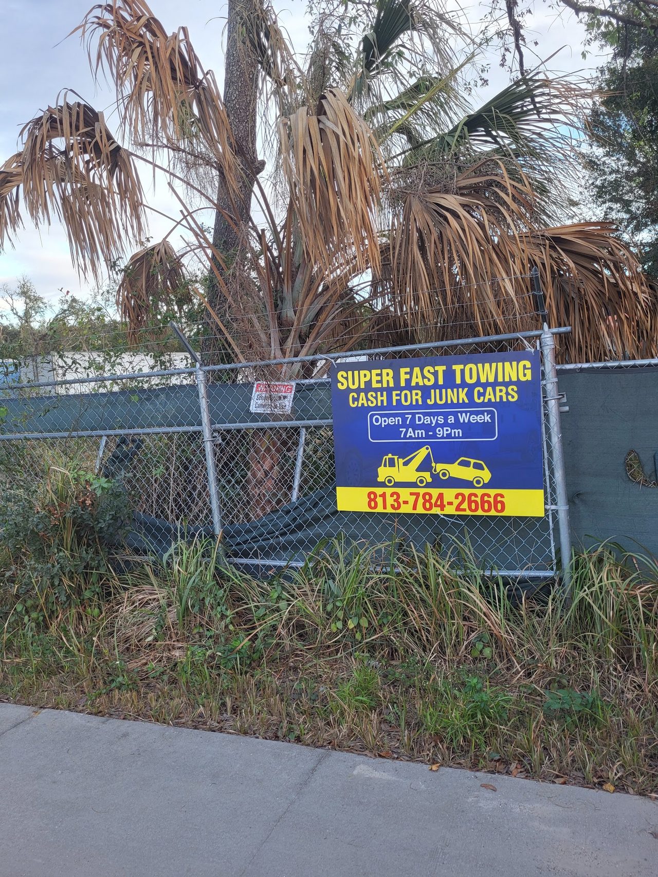 The Super Fast Towing yard entrance sign in Thonotosassa, FL